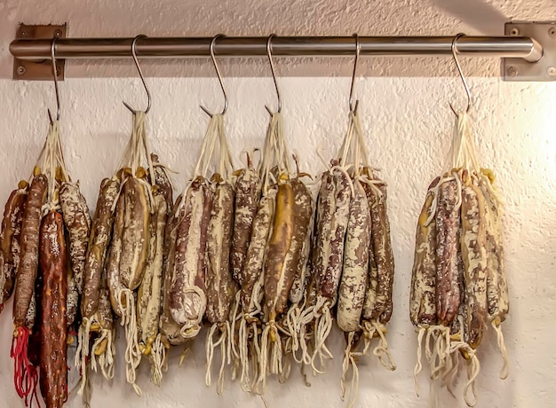 The Selling handicraft fuets on the wall of a shop in Spain