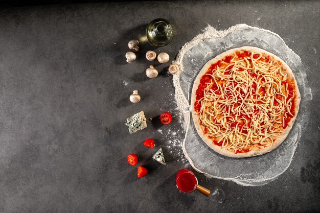 Semi finished pizza with cheese and tomato sauce