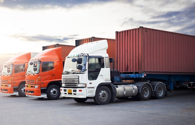 Semi trailer trucks parked lot with the sunset sky diesel truck\
freight truck logistics transport