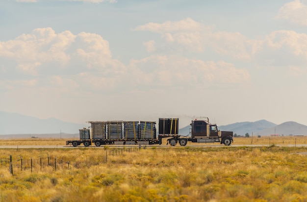 Semi Truck on a Highway Crossing Colorado Valley