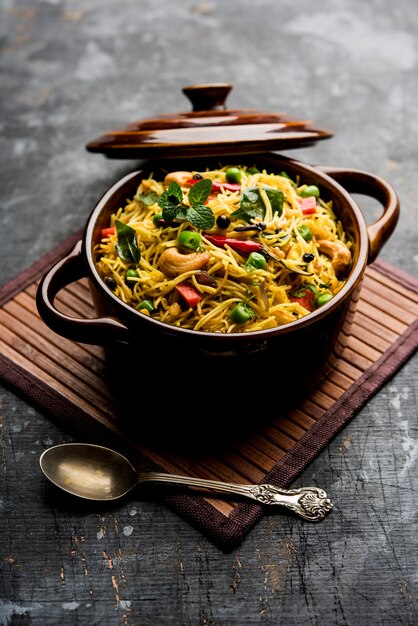 Semiya Upma or Vermicelli Uppuma or uppittu is a popular breakfast menu from south India. served in a bowl. selective focus