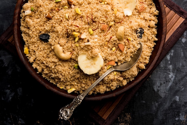 Semolina Halwa or Sooji ka Halva or sweet Rava Sheera or shira - Indian festival sweet made of semolina, nuts and Ghee