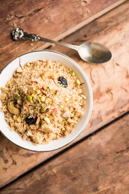 Semolina Halwa or Sooji ka Halva or sweet Rava Sheera or shira - Indian festival sweet made of semolina, nuts and Ghee