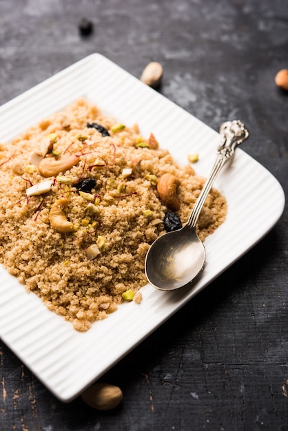 Semolina Halwa or Sooji ka Halva or sweet Rava Sheera or shira - Indian festival sweet made of semolina, nuts and Ghee