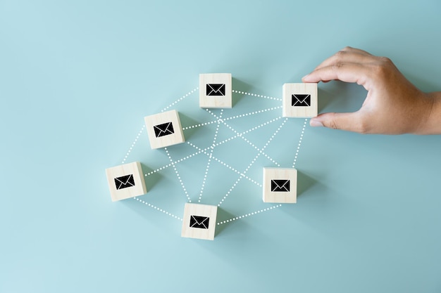 Sending and Receiving email concept using black envelopes and dot lines human hand picking up