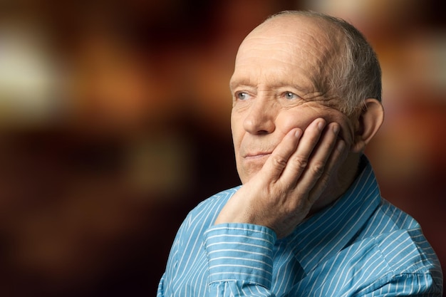 Senior adult old sadness man on bokeh background