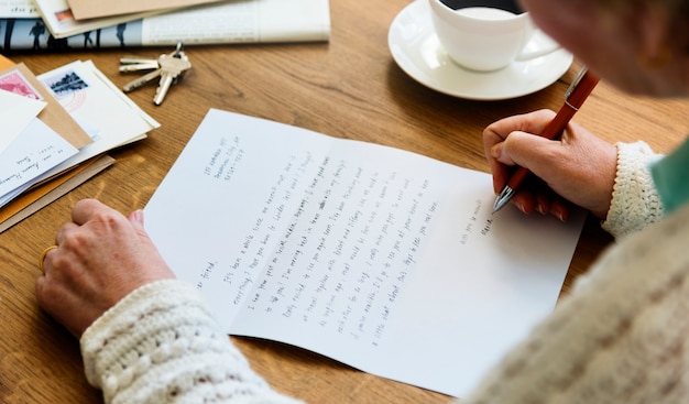 senior adult reading letter postcard concept