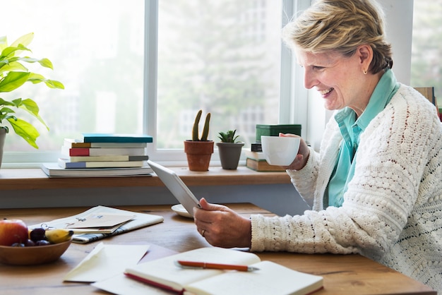 Senior Adult Using Digital Device Tablet Concept