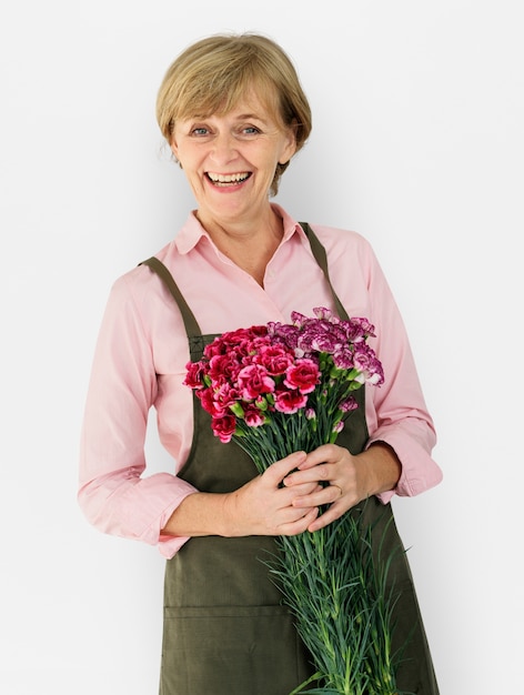 Senior Adult Woman Smiling Happiness Flower Studio Portrait