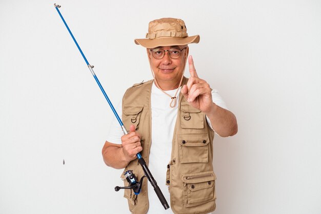 Senior american fisherman holding rod isolated on white background showing number one with finger.