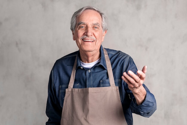 Senior American man wearing an apron