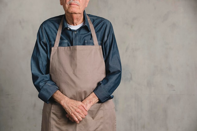 Senior American man wearing an apron