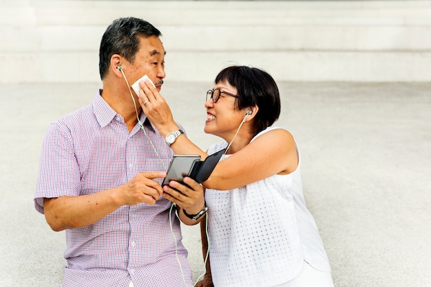 Senior asian couple standing playful concept