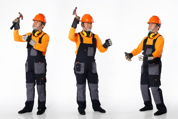 Senior Asian Man wear Orange uniform shirt hardhat and leather glove as engineer construction site labor. Full length of short small male stand poses hold hammer and carry, white background isolated