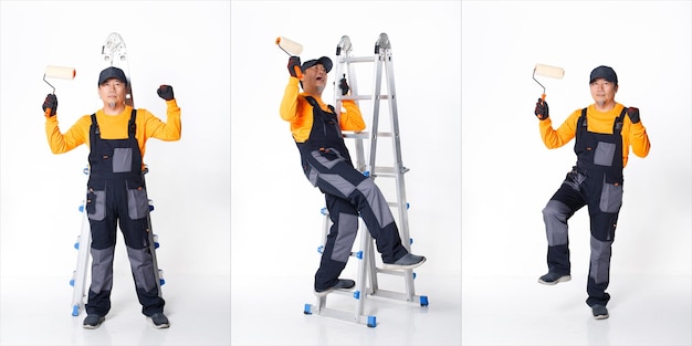シニアアジア人男性は、金属製の背の高いはしごで画家の労働としてオレンジ色の制服のシャツの帽子と手袋を着用しています。短い小さな男性ホールドブラシペイントローラーの全長、多くのビュー、分離された白い背景