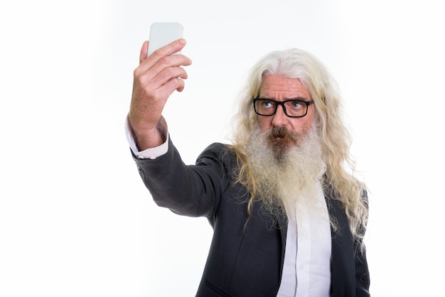 senior bearded businessman taking selfie picture