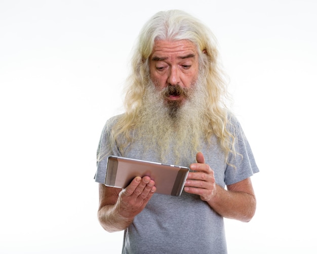 senior bearded man using digital tablet