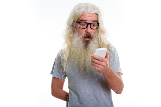 senior bearded man using mobile phone