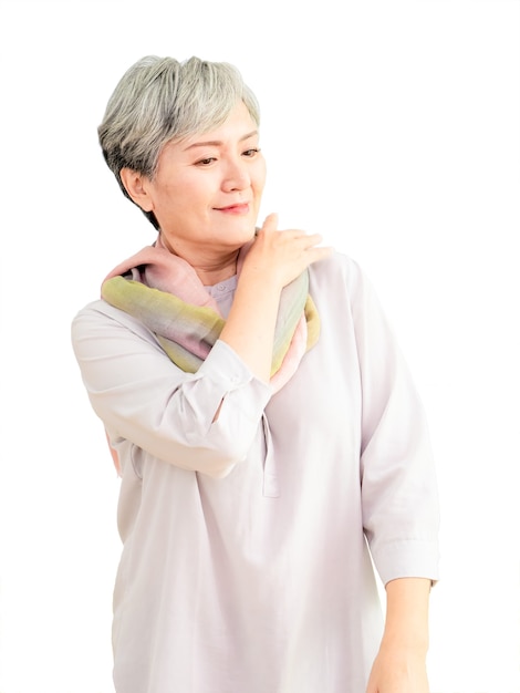 Senior beautiful grey-haired asian woman wearing casual dress and silk scarf