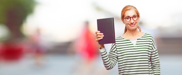 Senior beautiful woman with a book