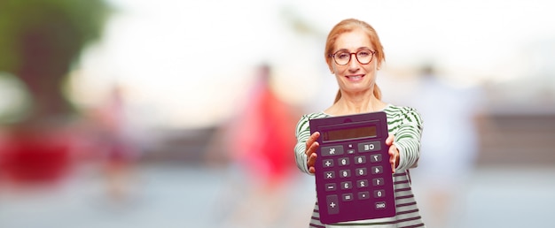 Senior beautiful woman with a calculator