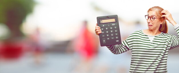 Senior beautiful woman with a calculator