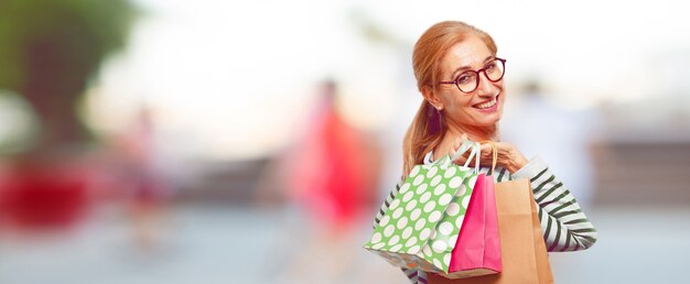 Senior beautiful woman with shopping bags