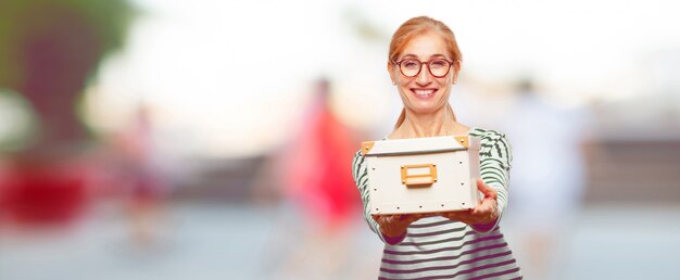 Senior beautiful woman with a vintage box