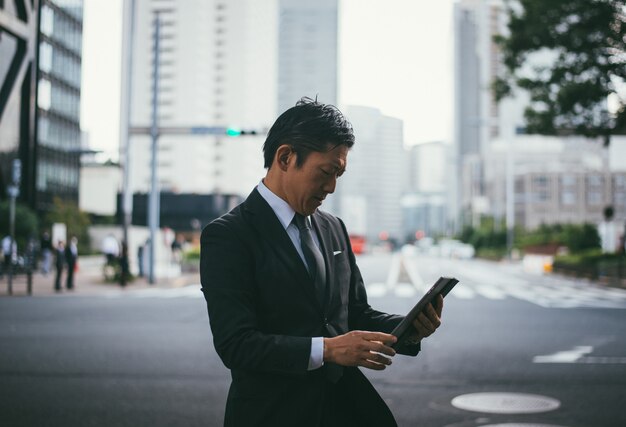 Senior business man moments on the streets of Tokyo