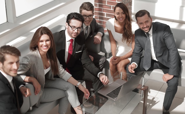 Senior businessman and business team sitting in the lobby of the modern officebusiness meeting