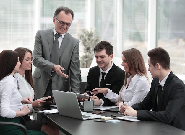 Senior businessman discussing with business team to work issues