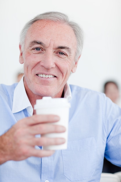 Senior businessman drinking a tea