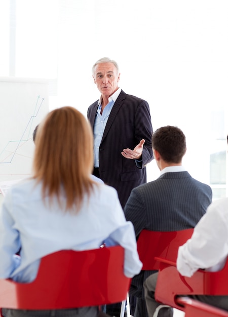 Senior businessman giving a conference