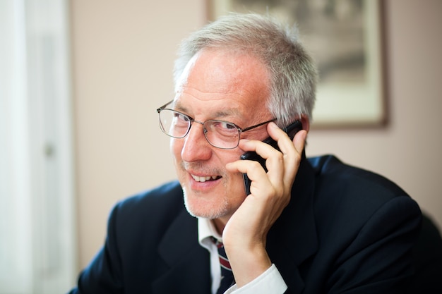 Senior businessman on the phone