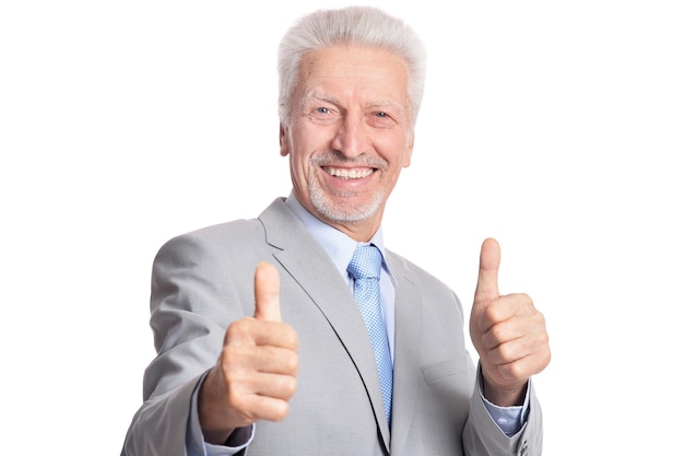 Senior businessman showing thumbs up