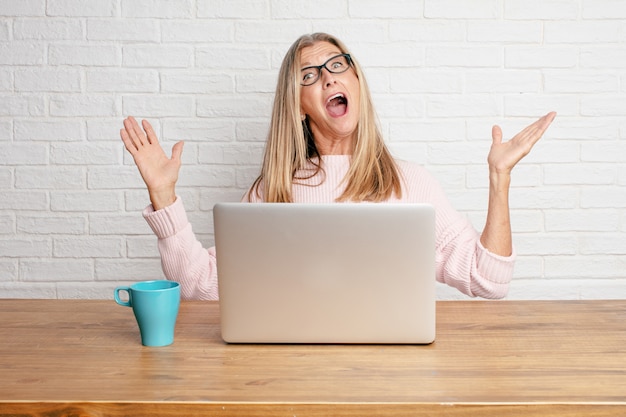 Senior businesswoman with a happy surprised expression