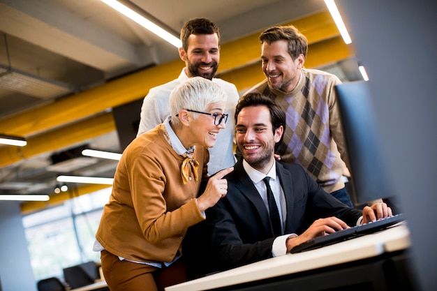 Senior businesswoman and young business people work in a  office