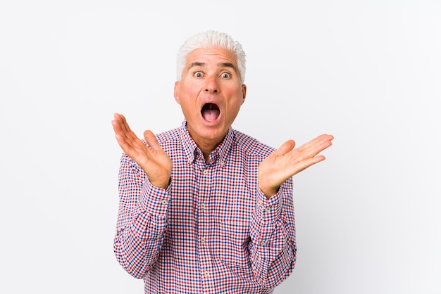 Senior caucasian man isolated surprised and shocked