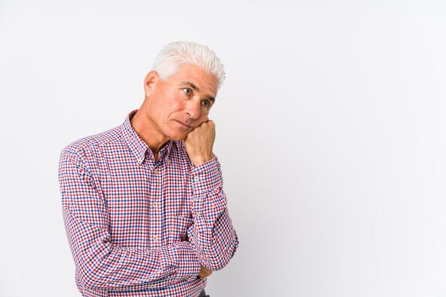 Senior caucasian man isolated who feels sad and pensive, looking at copy space