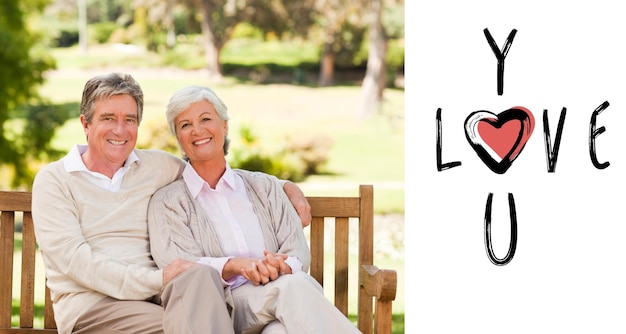 Senior couple on the bench against cute valentines message