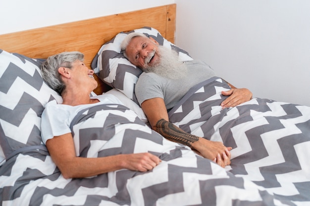 Senior couple under the blanket at home