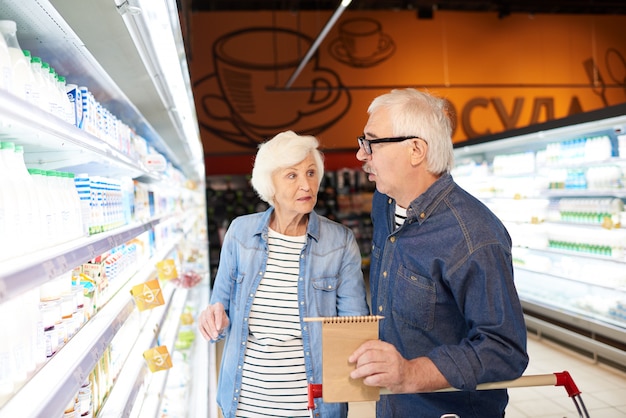 Senior Couple Choosing Milk