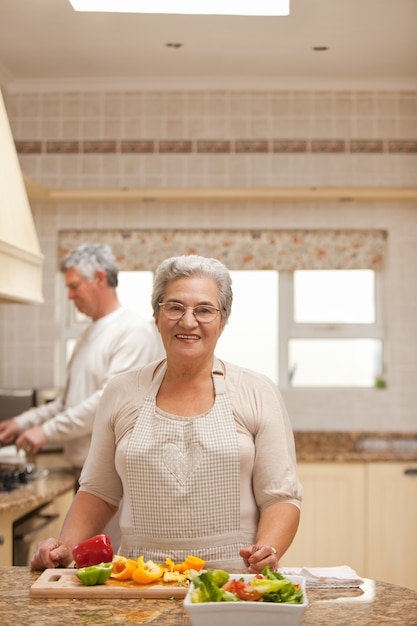 Senior couple cooking in the kitchen