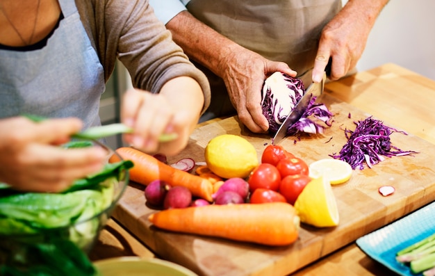 Senior couple cooking together in the kitchen