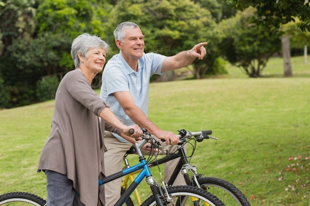 Senior couple on cycle ride in countryside