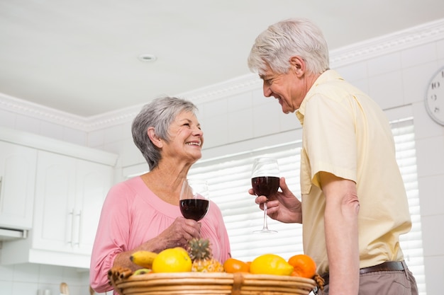 Senior couple drinking red wine