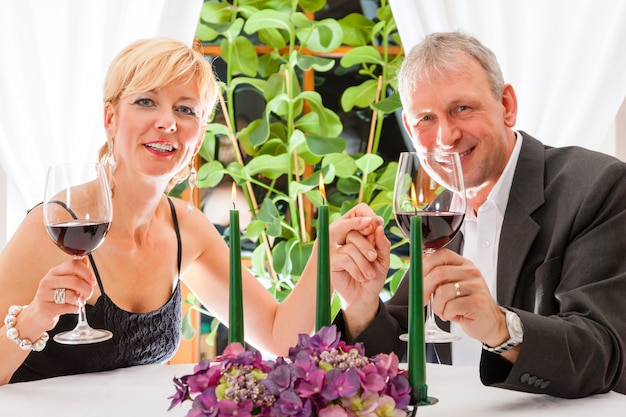 Senior couple eating dinner in restaurant