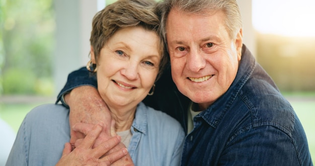 Photo senior couple happy or portrait in home with loyalty commitment or retirement together as family mature man woman or marriage pride for gratitude on face embrace or trust or wellness in house