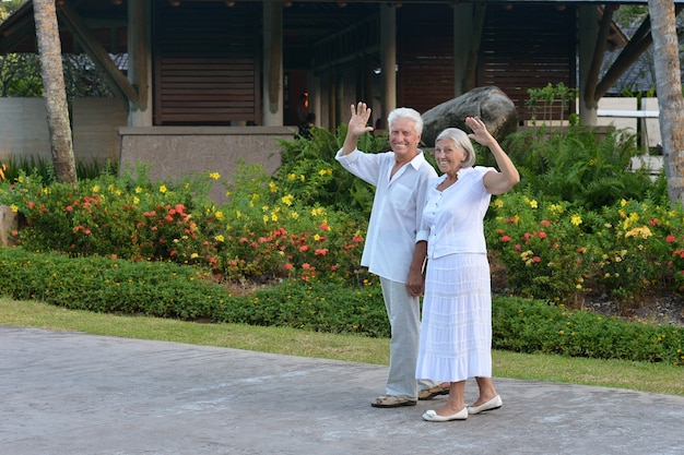 Senior couple have fun near  hotel resort