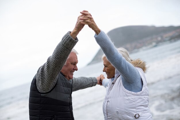 Senior couple having fun together at beach